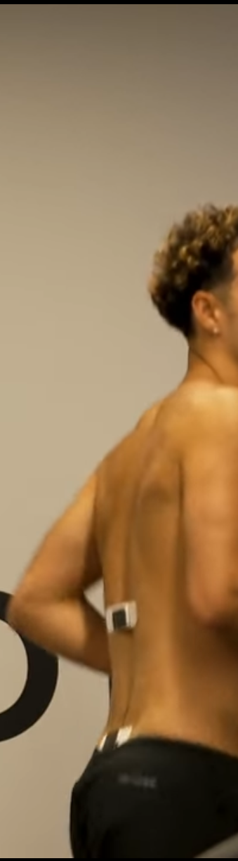 Athlete wearing two Bekalo biosensor patches on the lower back